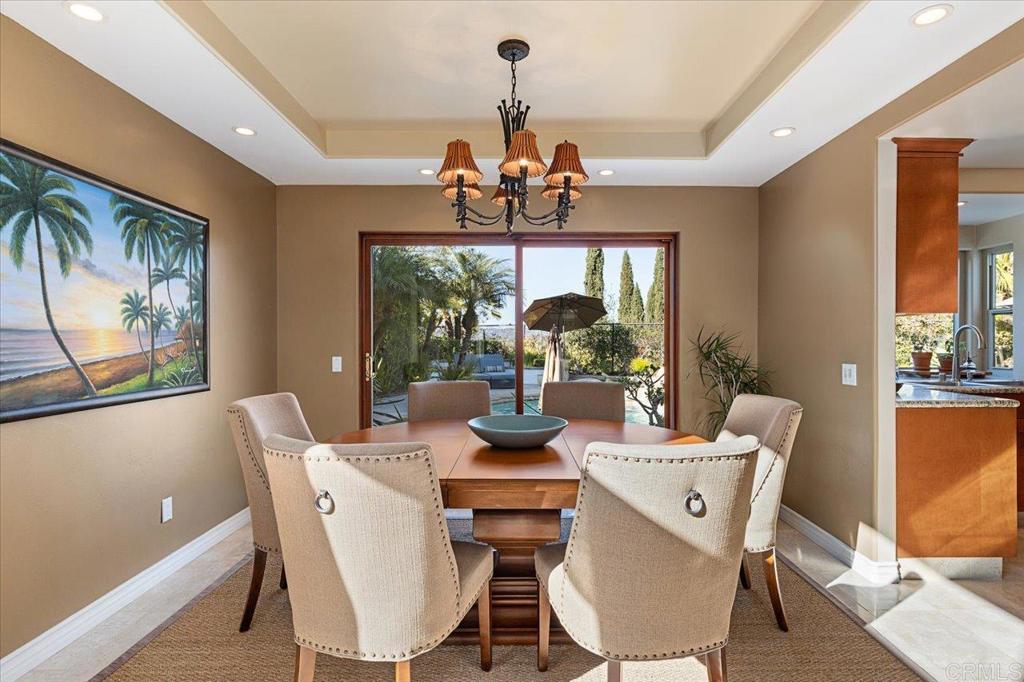 1832 Avenida Flores Encinitas, CA 92024 - Photo 21 of 72 a view of a dining room with furniture wooden floor and chandelier