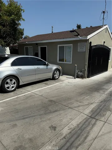 a view of a car parked in front of a house