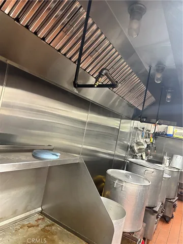a kitchen with stainless steel appliances a sink and cabinets