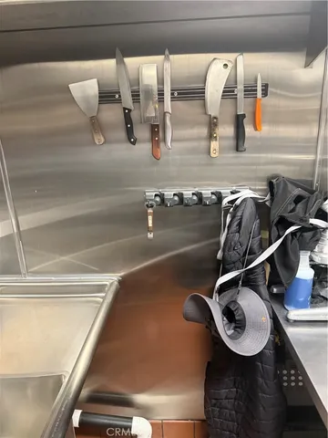 a room with water heater and wooden floor