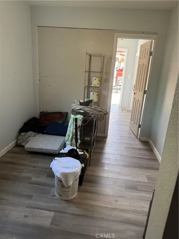 a view of a livingroom with furniture and hardwood floor