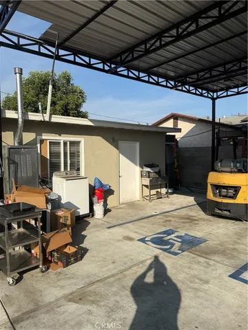 a view of a garage with cars parked