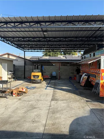 a view of parking garage with cars