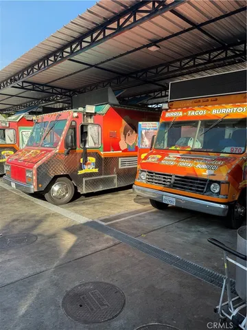 a view of parking garage with cars