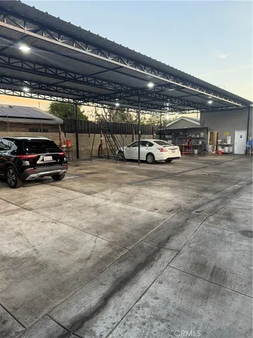 a view of parking garage with cars