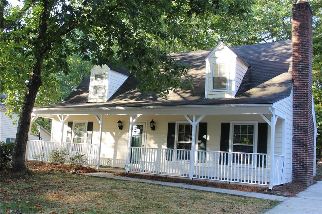 1122 Eagle Road Greensboro, NC 27407 - Photo 2 of 16 Front with rocking chair front porch