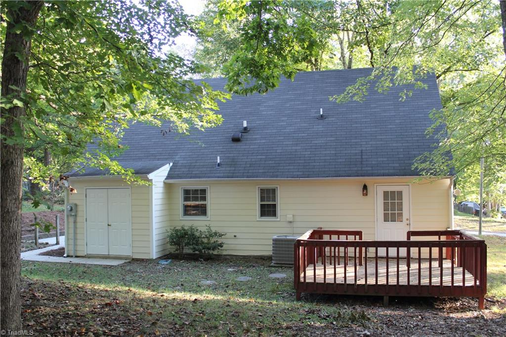 1122 Eagle Road Greensboro, NC 27407 - Photo 3 of 16 Back with storage building and deck