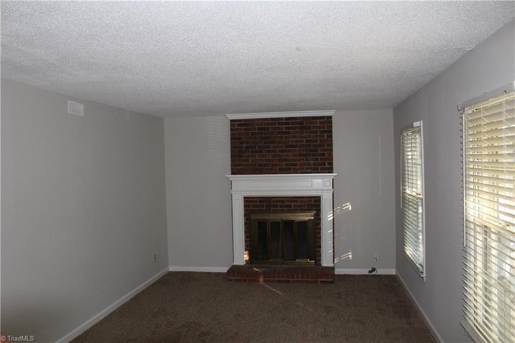 1122 Eagle Road Greensboro, NC 27407 - Photo 4 of 16 Living Room with Fireplace