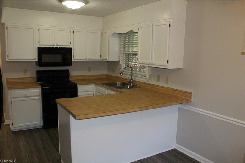 1122 Eagle Road Greensboro, NC 27407 - Photo 8 of 16 Kitchen with bar seating