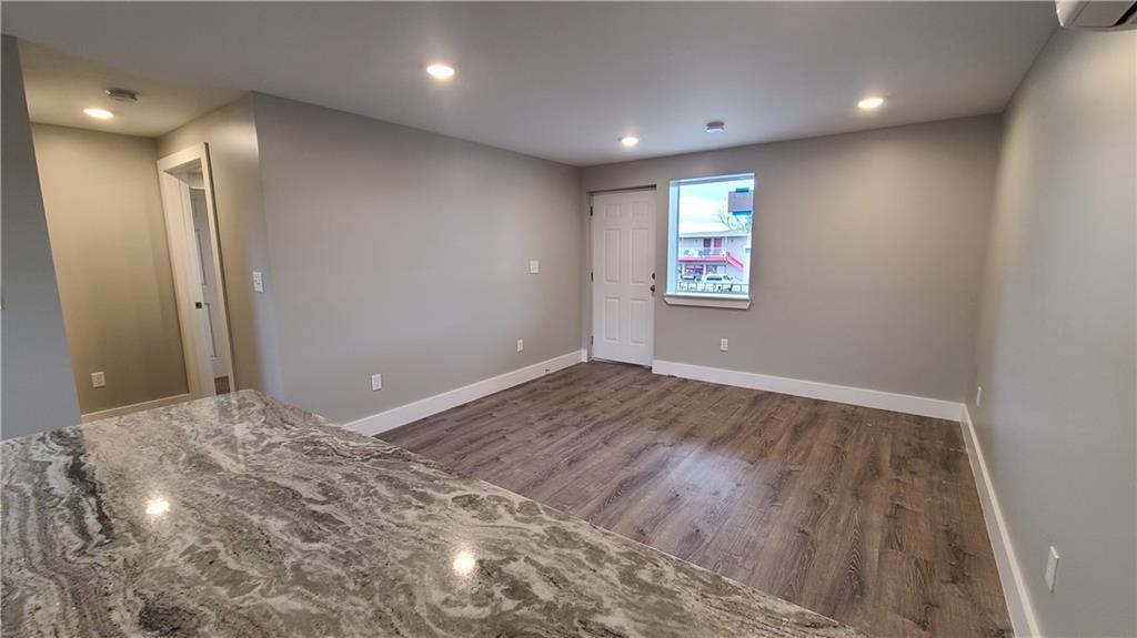1331 Freeport Road Cheswick, PA 15024 - Photo 11 of 32 an empty room with wooden floor and windows