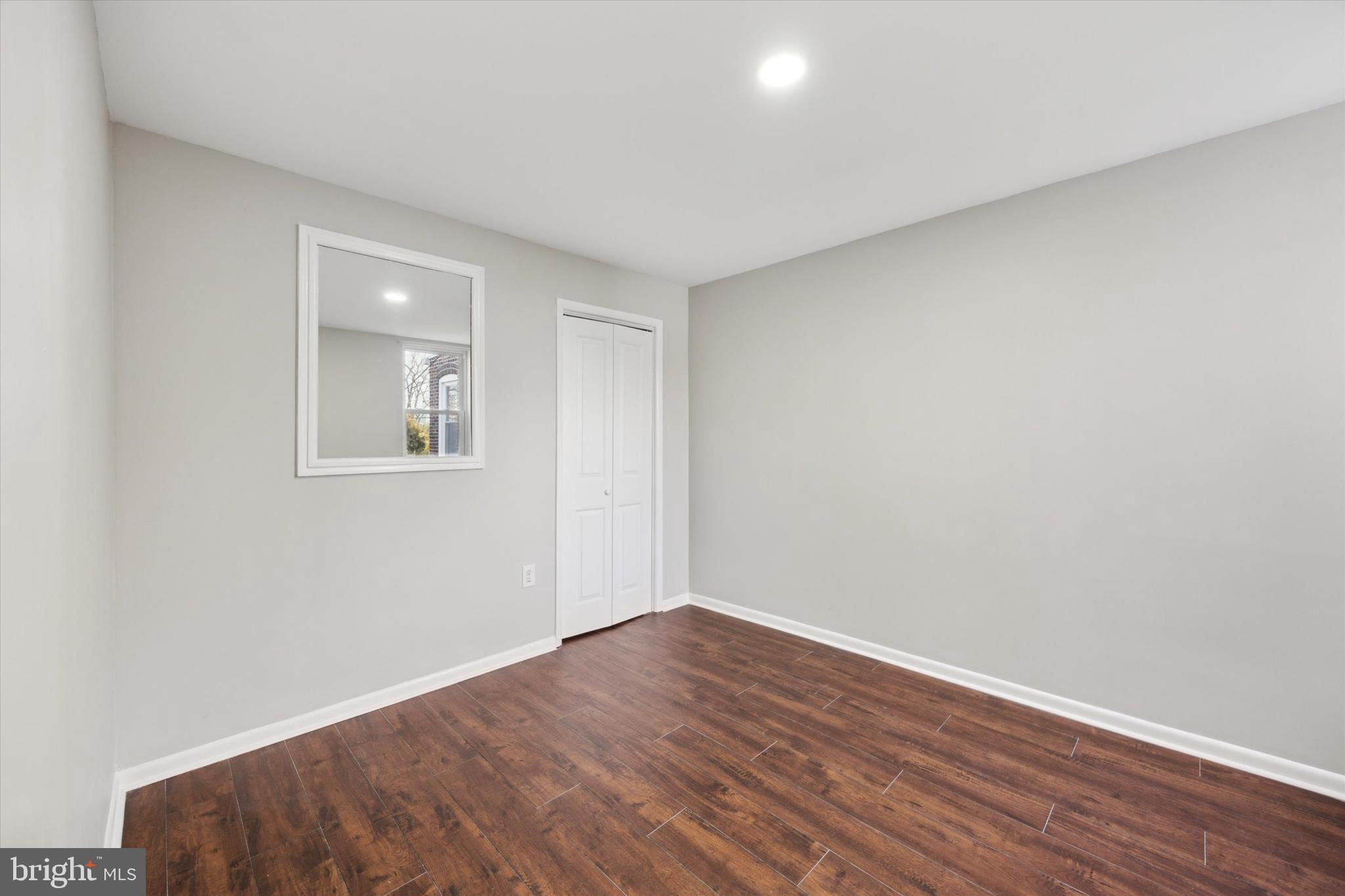 147 7th Avenue Roebling, NJ 08554 - Photo 11 of 13 a view of an empty room with wooden floor and a window