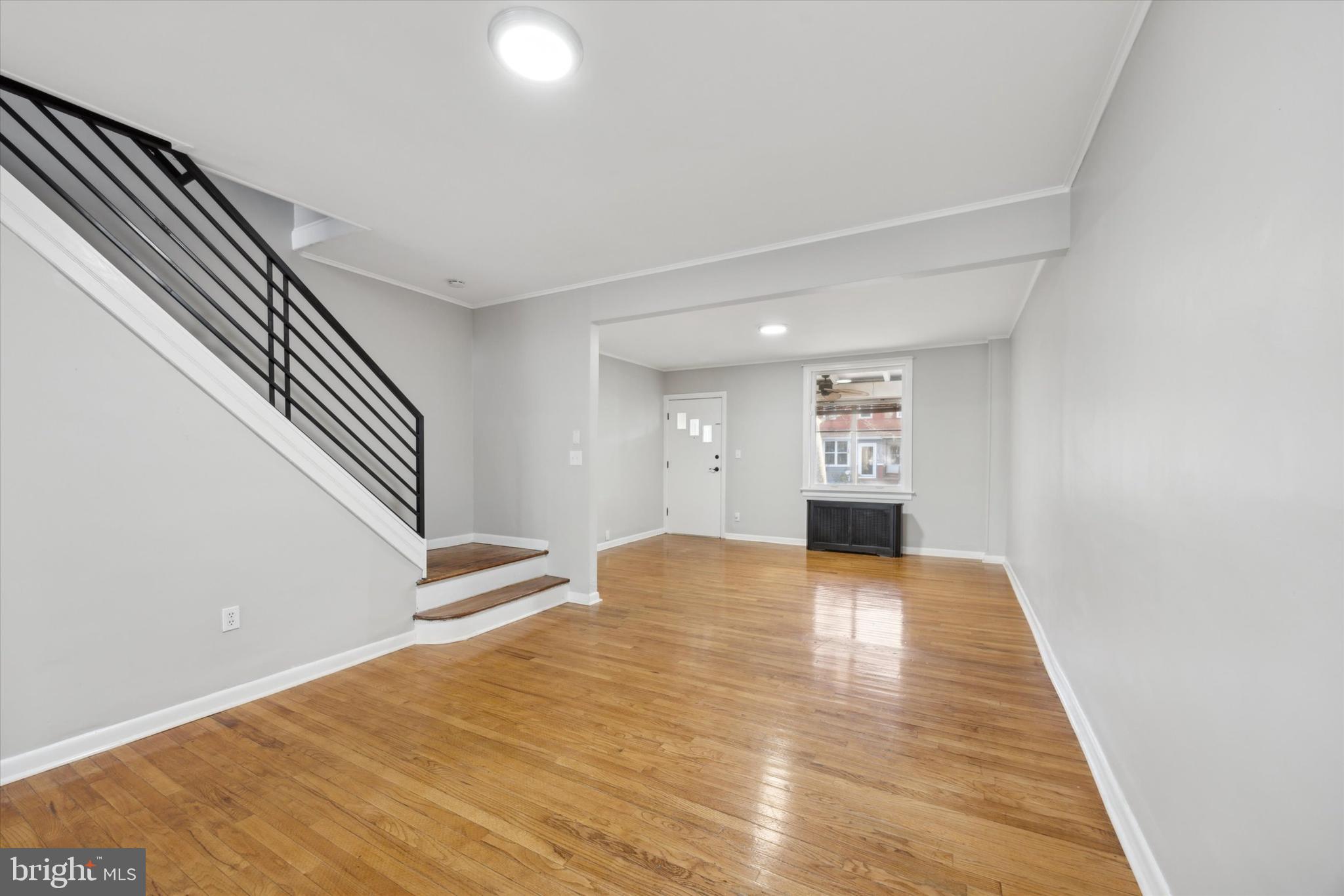 147 7th Avenue Roebling, NJ 08554 - Photo 5 of 13 a view of an empty room with wooden floor and kitchen
