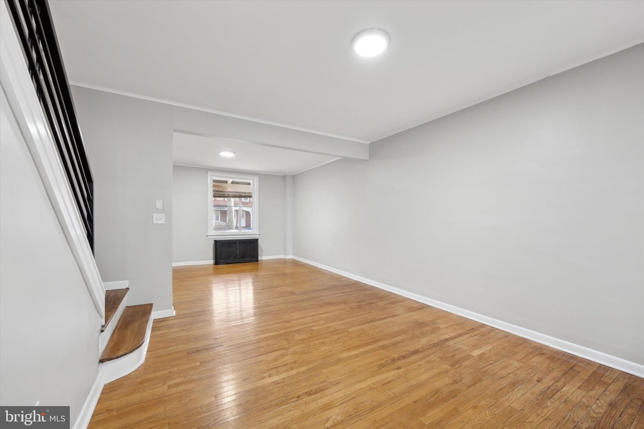 147 7th Avenue Roebling, NJ 08554 - Photo 6 of 13 an empty room with wooden floor and windows