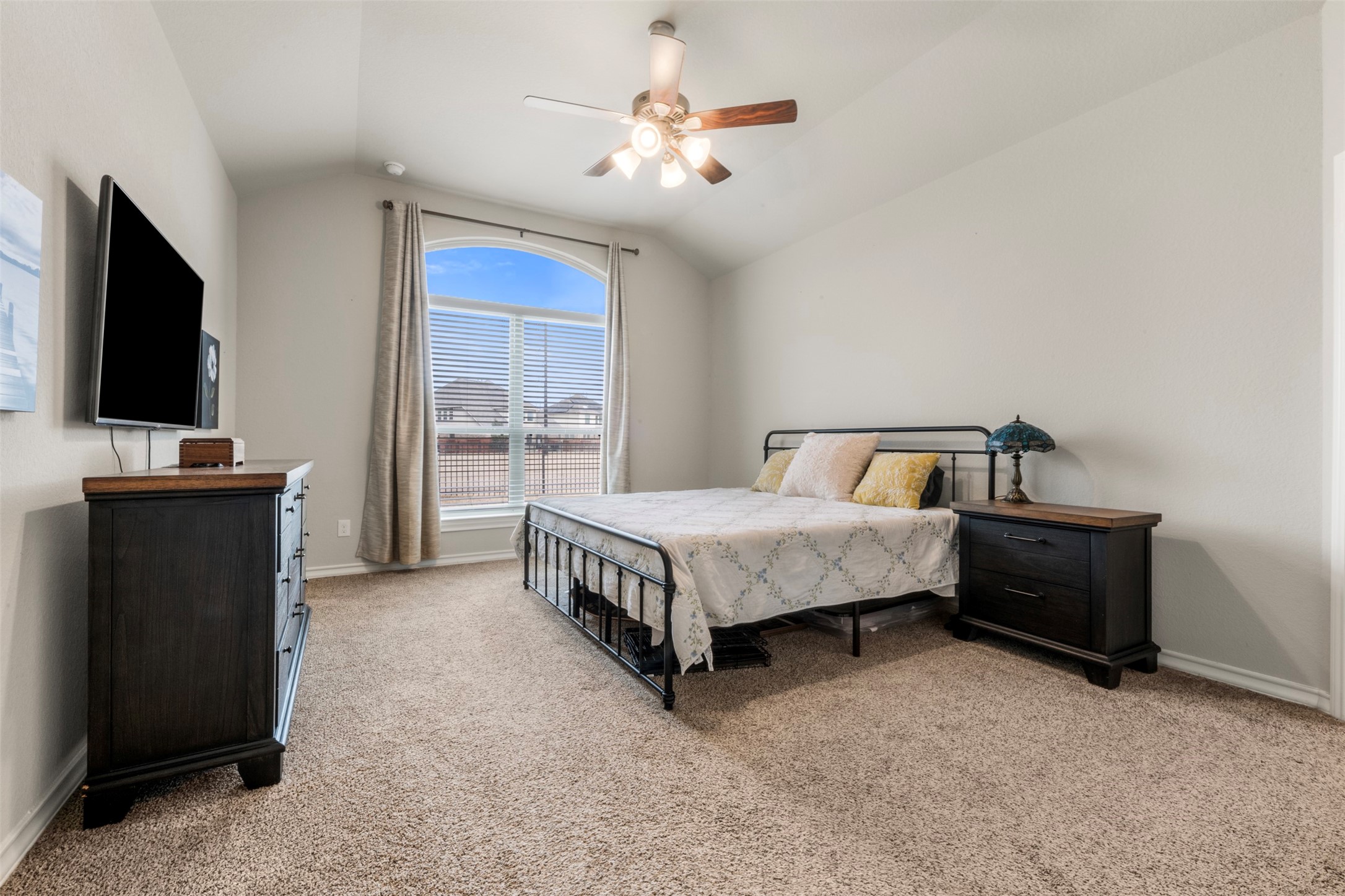 6210 Mason Way Rosenberg, TX 77471 - Photo 16 of 31 a bedroom with a bed and a flat tv screen on dresser