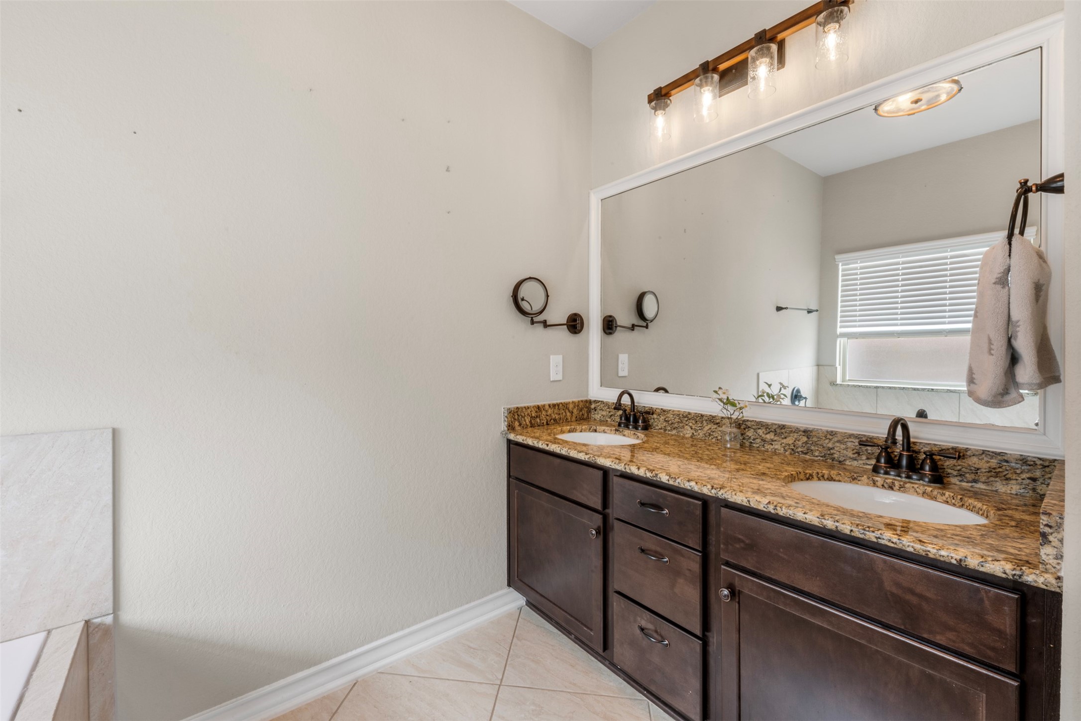 6210 Mason Way Rosenberg, TX 77471 - Photo 18 of 31 a bathroom with a granite countertop sink and a mirror