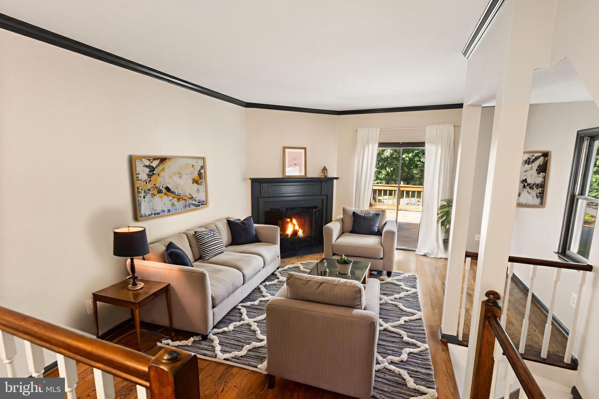 1700 Quietree Drive Reston, VA 20194 - Photo 13 of 76 a living room with furniture and a fireplace