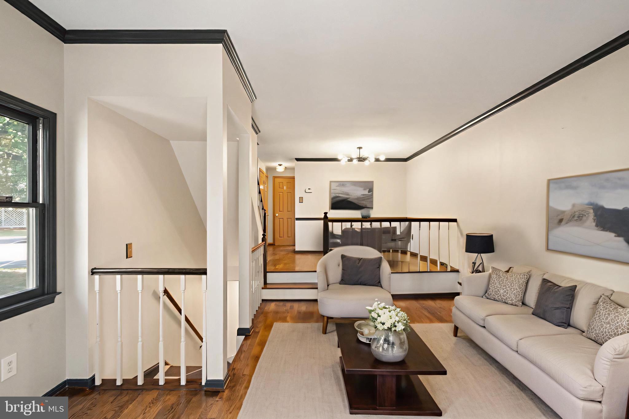 1700 Quietree Drive Reston, VA 20194 - Photo 17 of 76 a living room with furniture and a large window