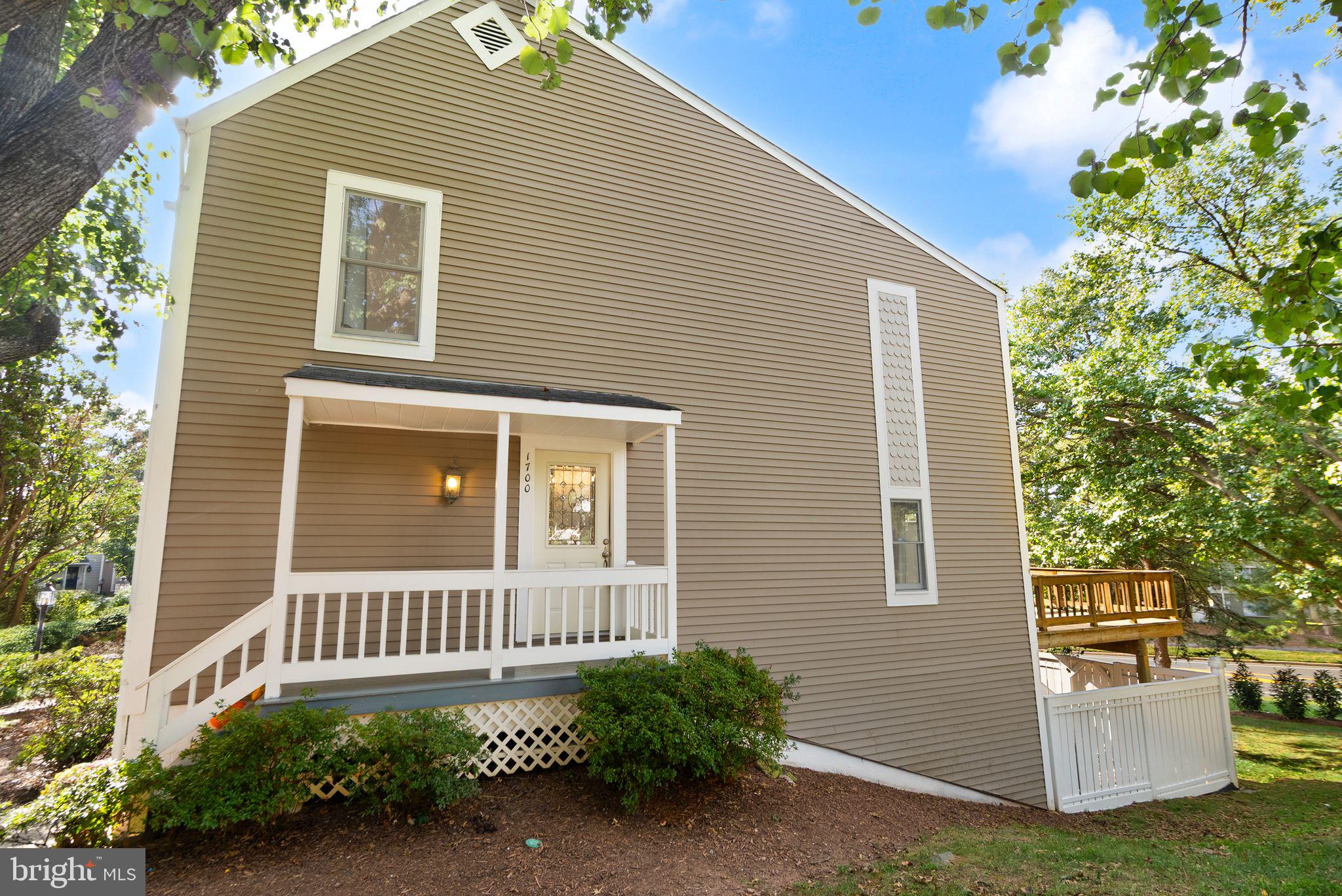 1700 Quietree Drive Reston, VA 20194 - Photo 3 of 76 a view of a house with a yard and plants