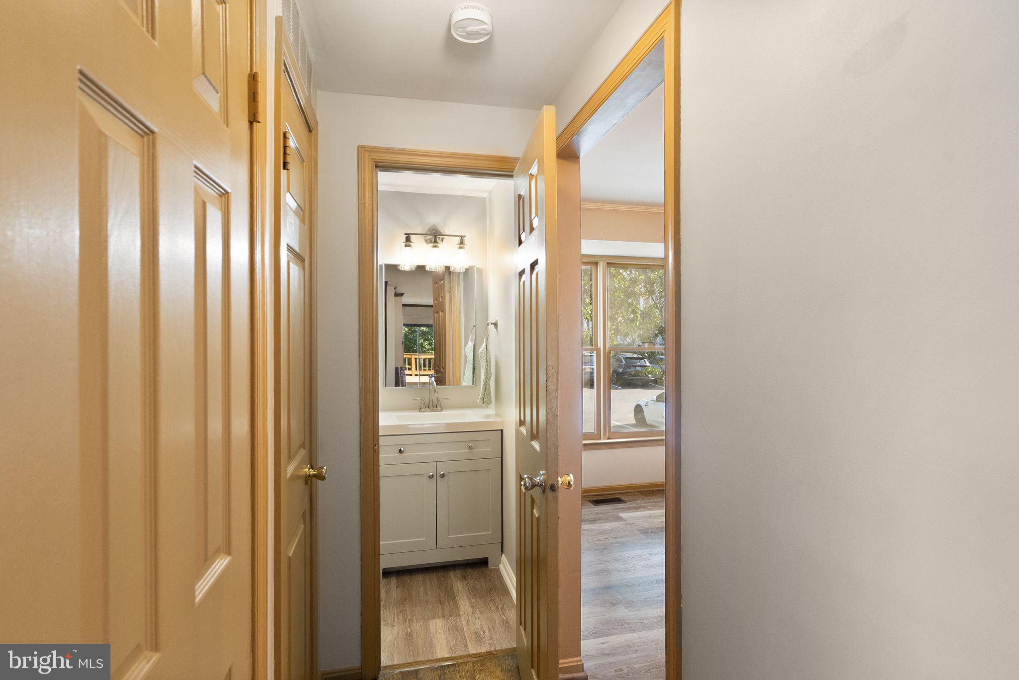 1700 Quietree Drive Reston, VA 20194 - Photo 34 of 76 a bathroom with a glass door shower and a sink