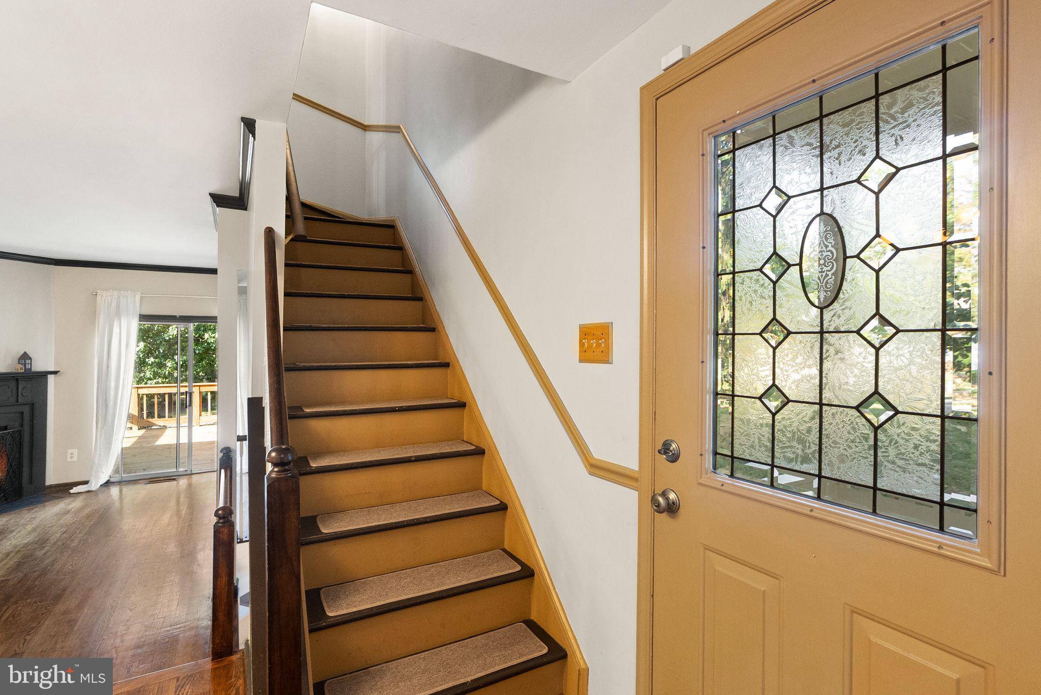 1700 Quietree Drive Reston, VA 20194 - Photo 36 of 76 a view of an entryway with wooden floor and door