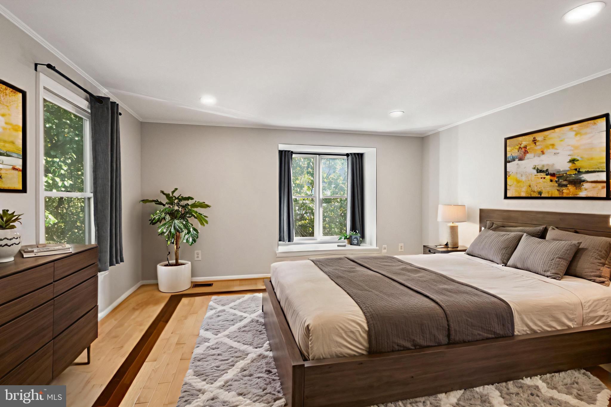 1700 Quietree Drive Reston, VA 20194 - Photo 38 of 76 a bedroom with a large bed and a large window