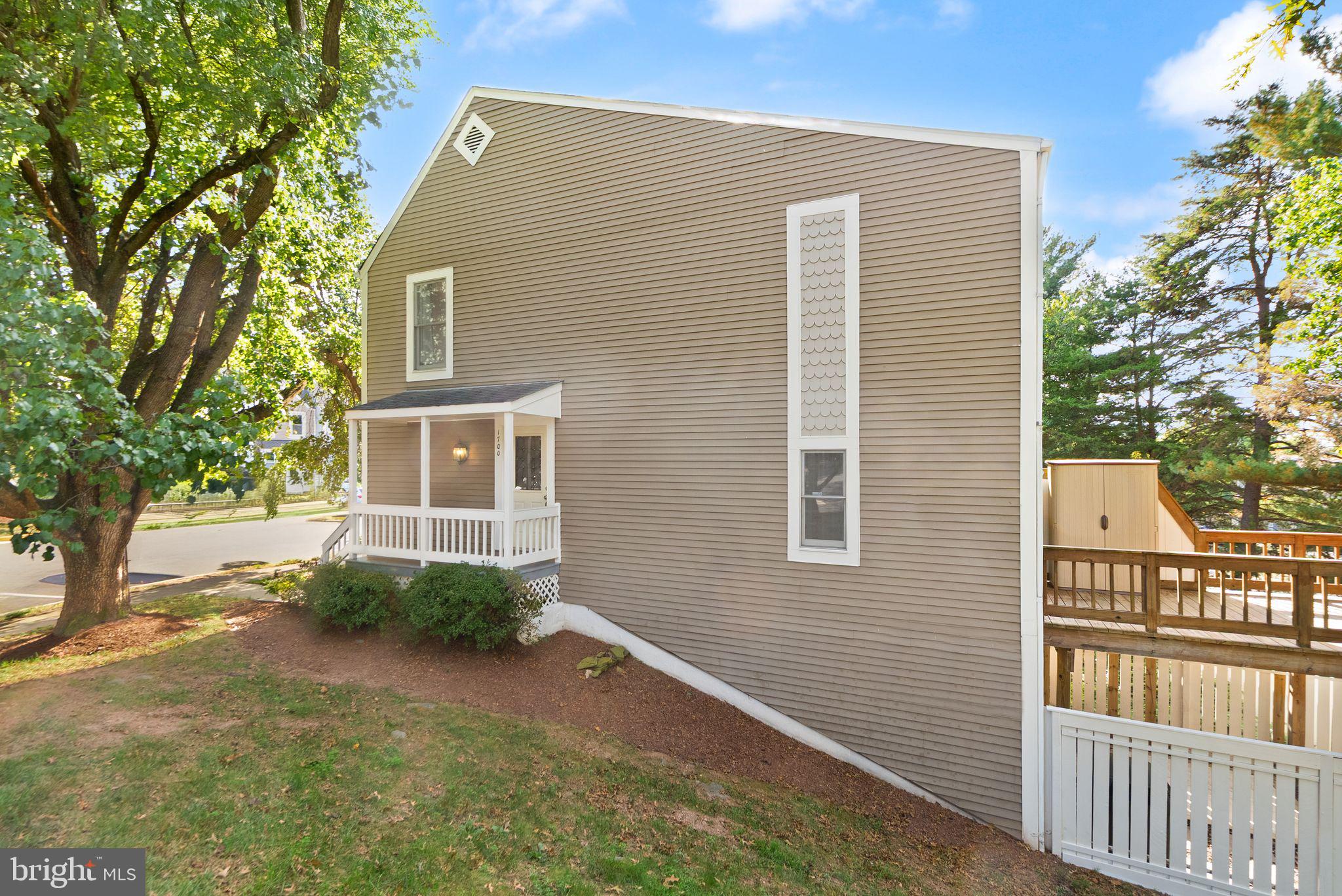 1700 Quietree Drive Reston, VA 20194 - Photo 4 of 76 a view of a house with a yard and a large tree