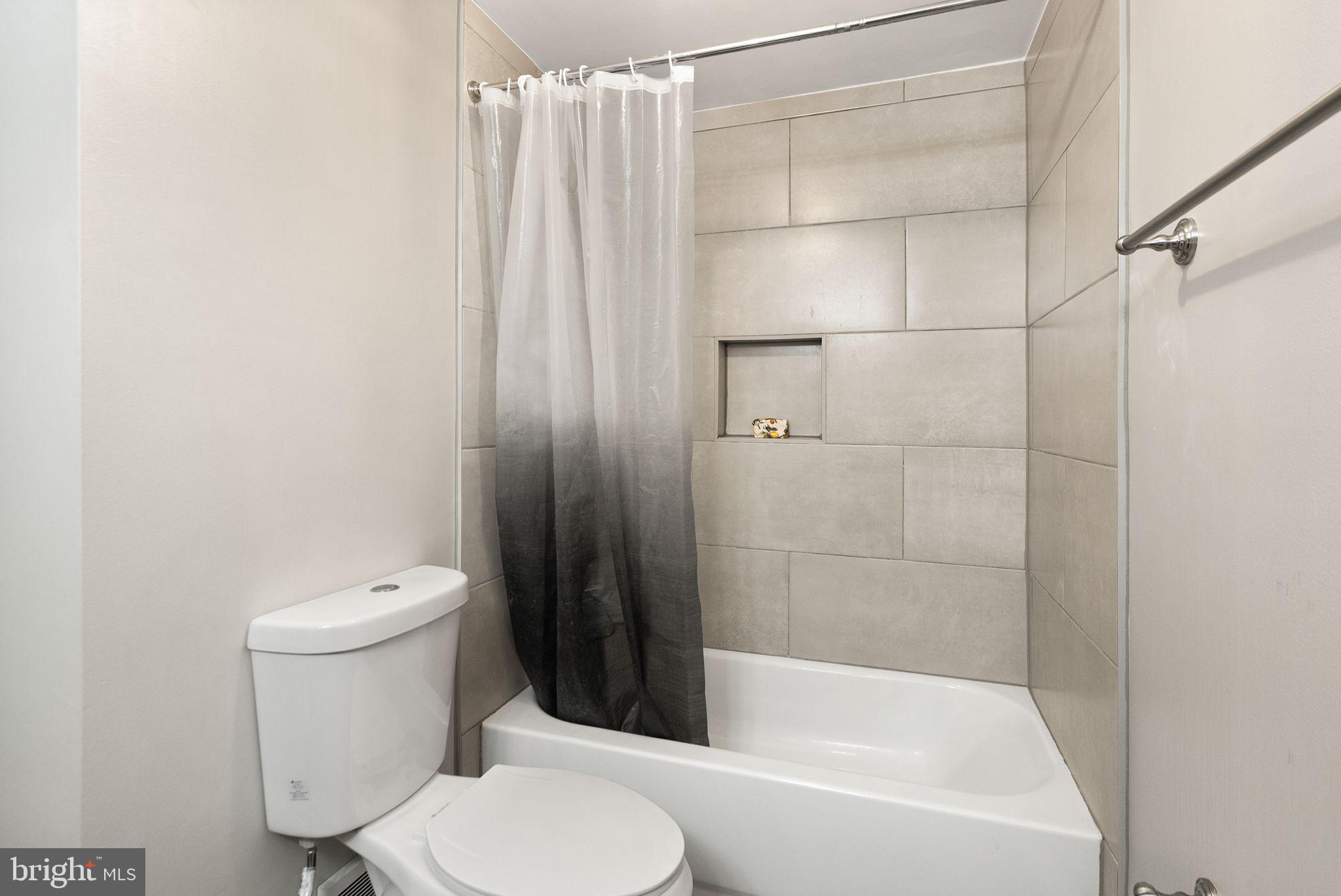 1700 Quietree Drive Reston, VA 20194 - Photo 50 of 76 a white toilet sitting next to a bath tub