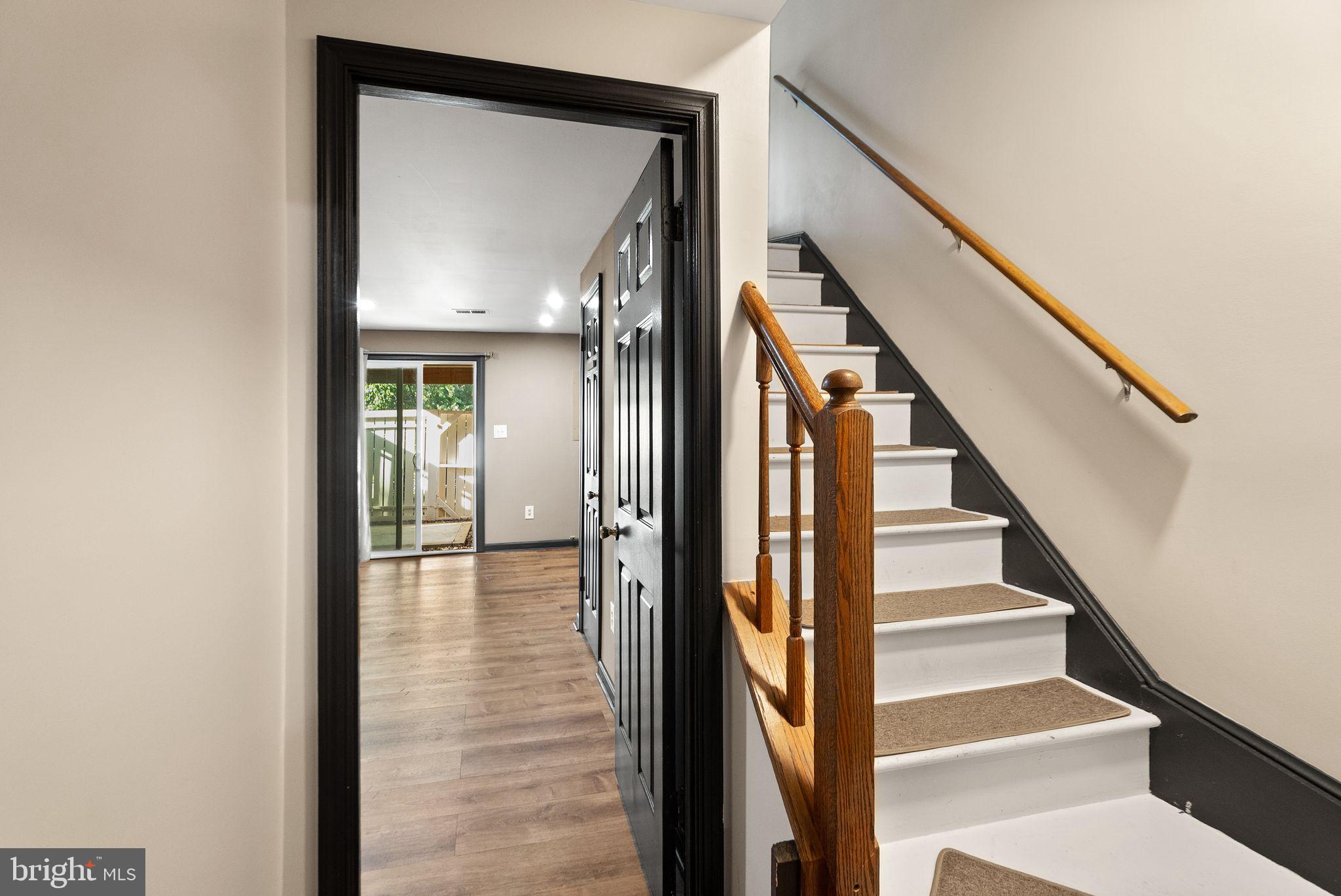 1700 Quietree Drive Reston, VA 20194 - Photo 51 of 76 a view of a hallway with wooden floor and entryway
