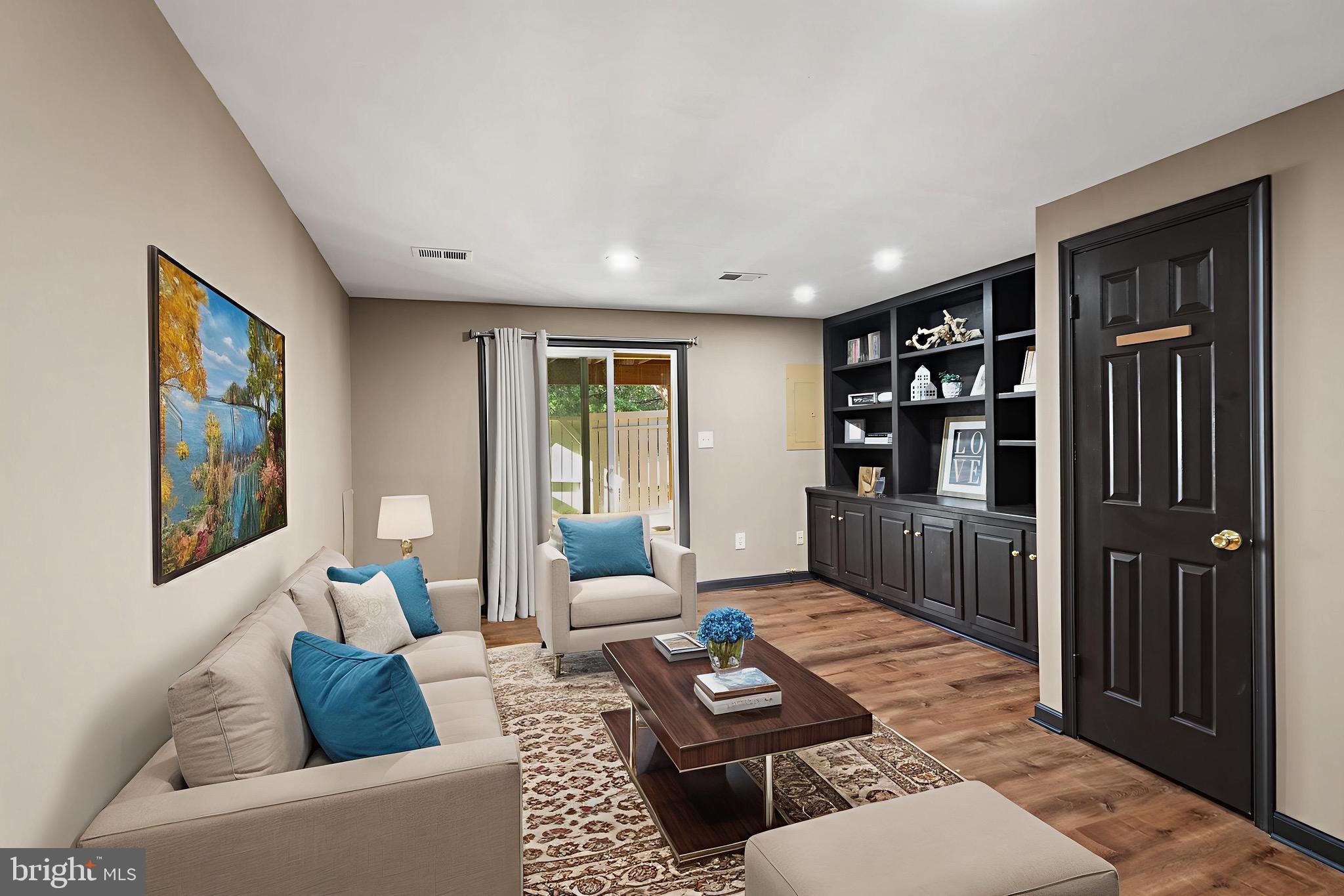 1700 Quietree Drive Reston, VA 20194 - Photo 53 of 76 a living room with furniture and a window