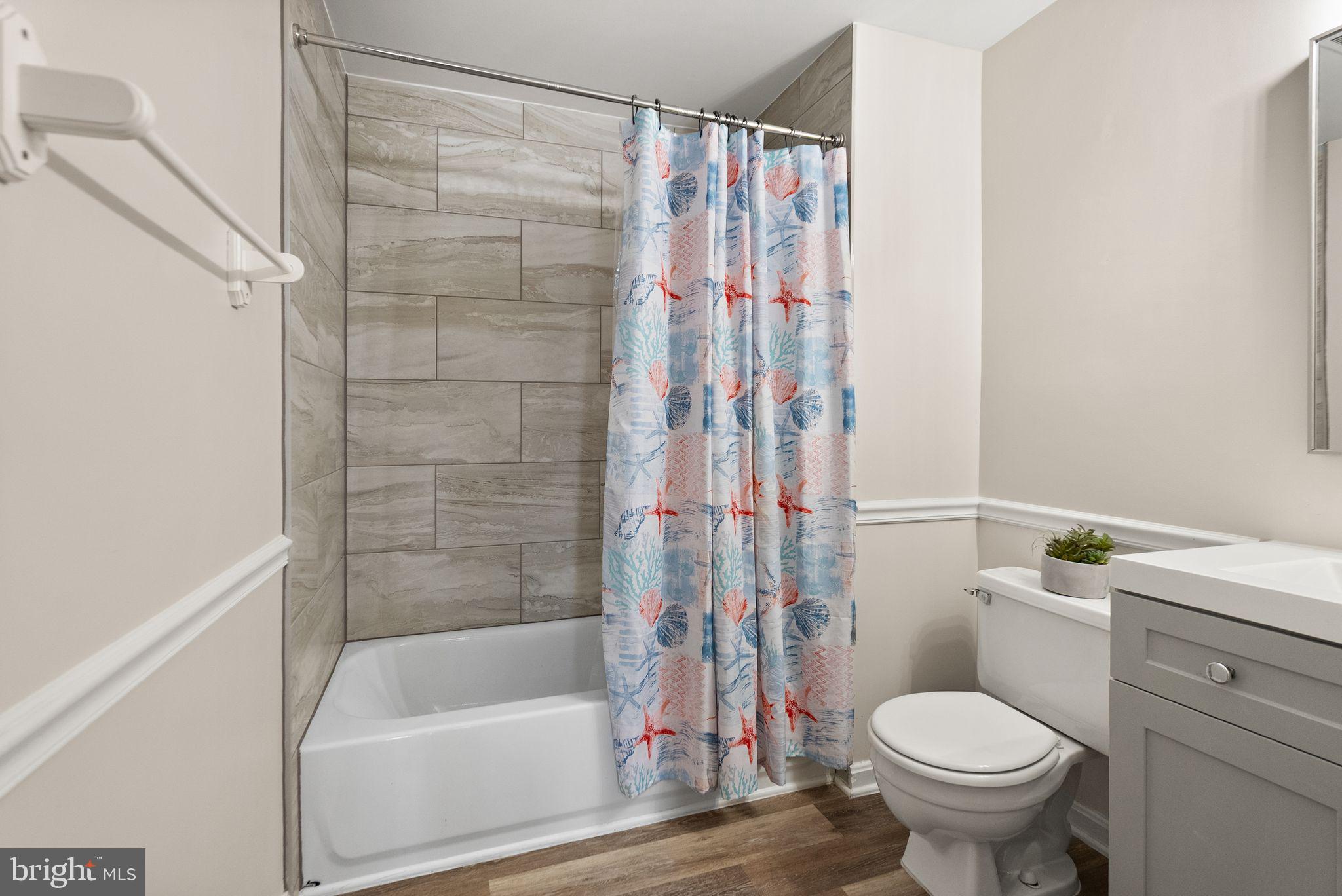 1700 Quietree Drive Reston, VA 20194 - Photo 60 of 76 a bathroom with a toilet and a bathtub