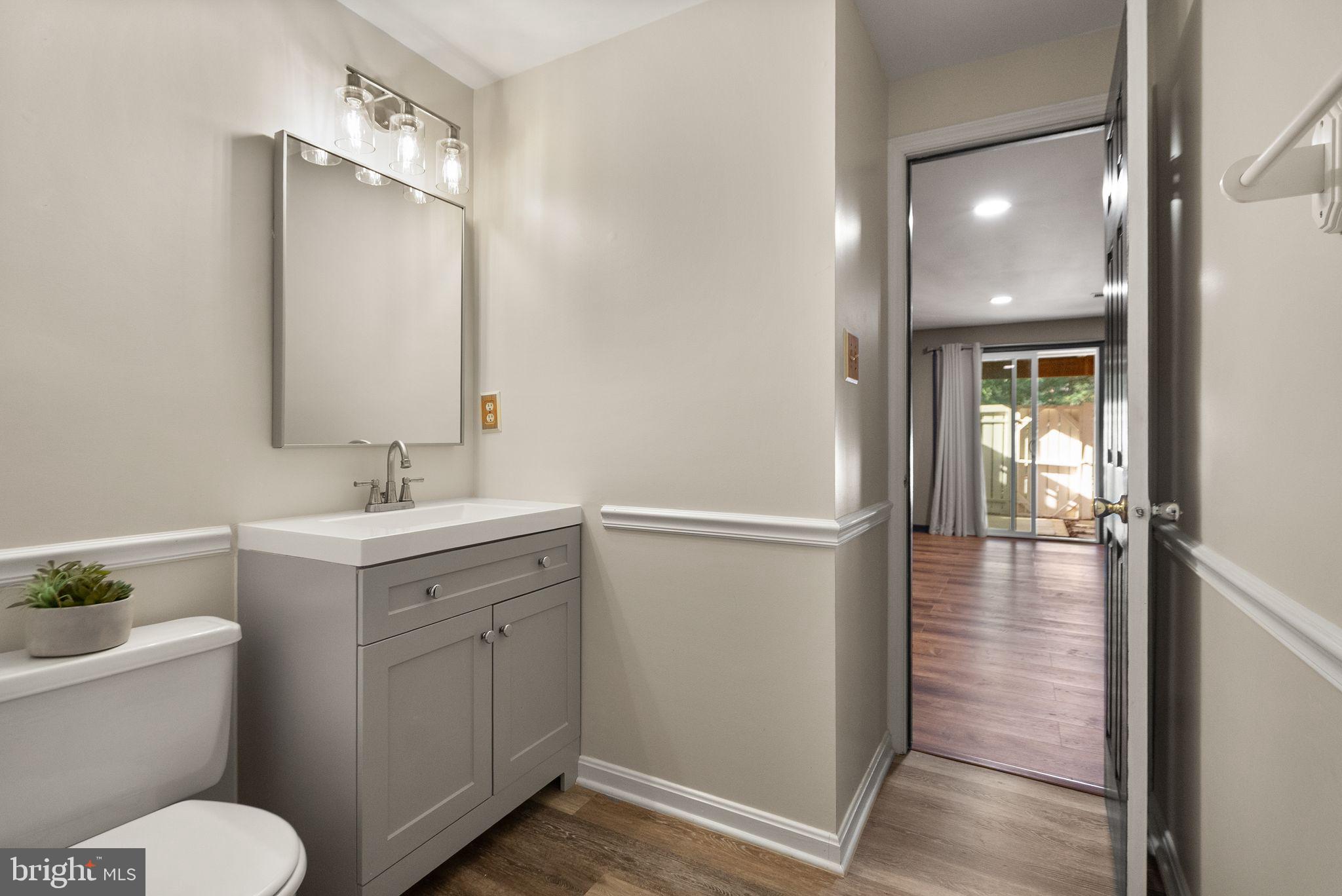 1700 Quietree Drive Reston, VA 20194 - Photo 61 of 76 a bathroom with a sink toilet and shower