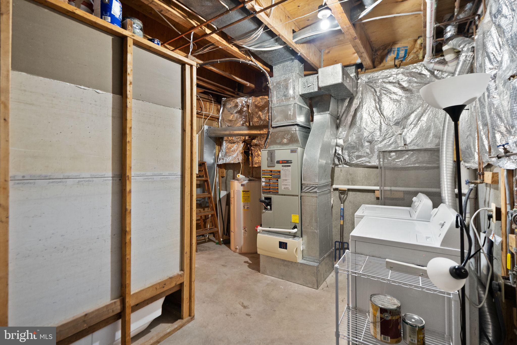 1700 Quietree Drive Reston, VA 20194 - Photo 64 of 76 a view of walk in closet with clothes and shoes