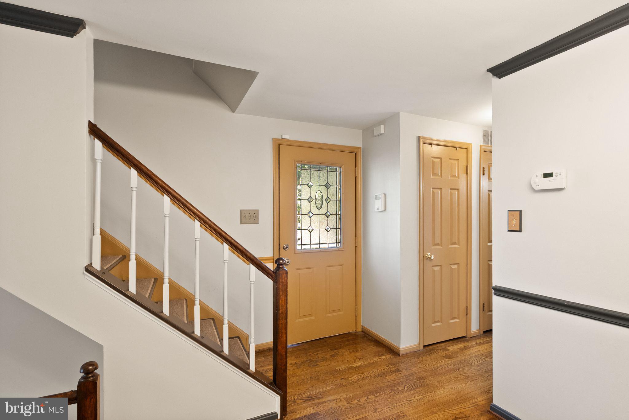 1700 Quietree Drive Reston, VA 20194 - Photo 9 of 76 a view of an entryway with staircase