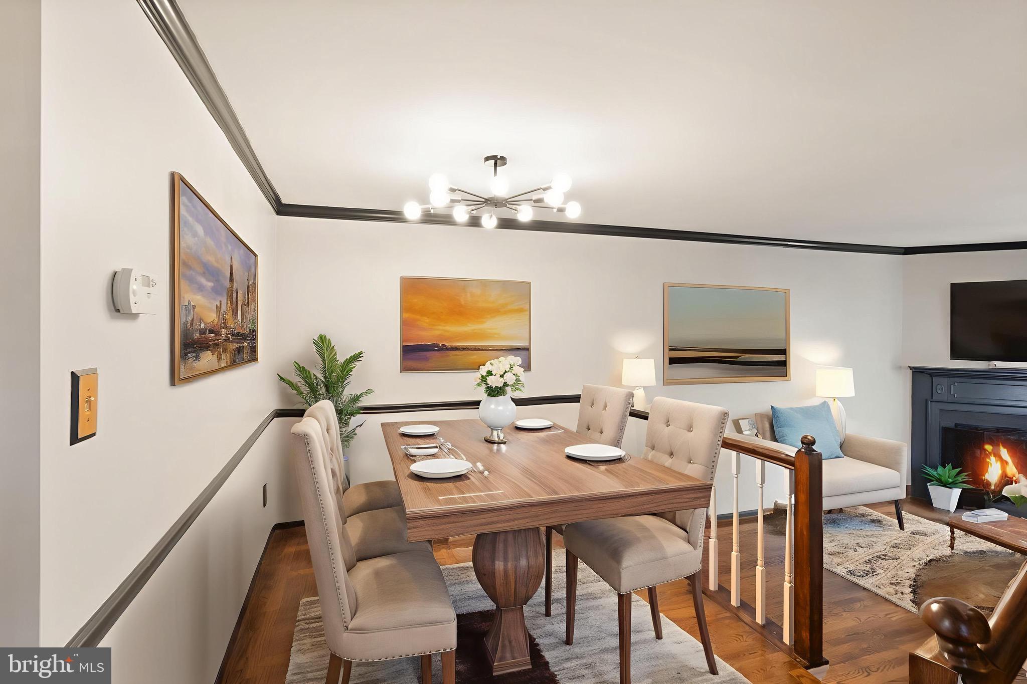 1700 Quietree Drive Reston, VA 20194 - Photo 10 of 76 a view of a dining room with furniture and a flat screen tv