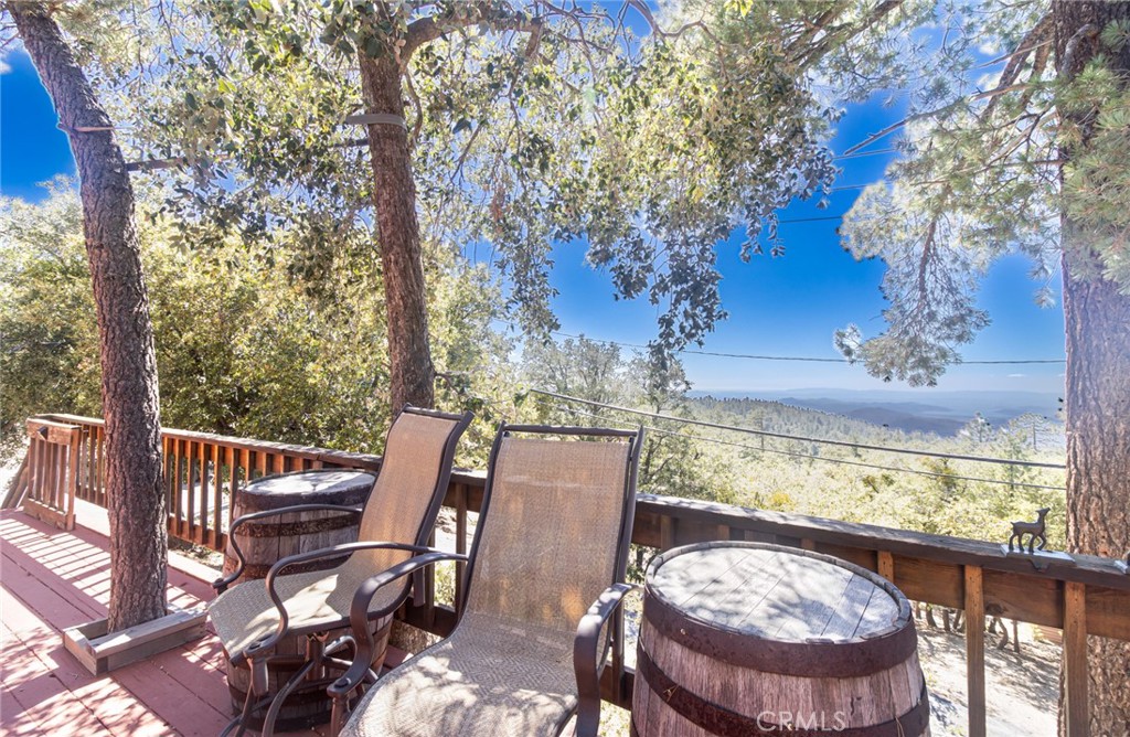 24387 Rocky Point Road Idyllwild, CA 92549 - Photo 23 of 29 a view of a chairs and table in the patio
