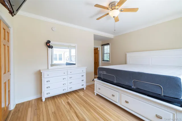 a room with a dresser and a chandelier