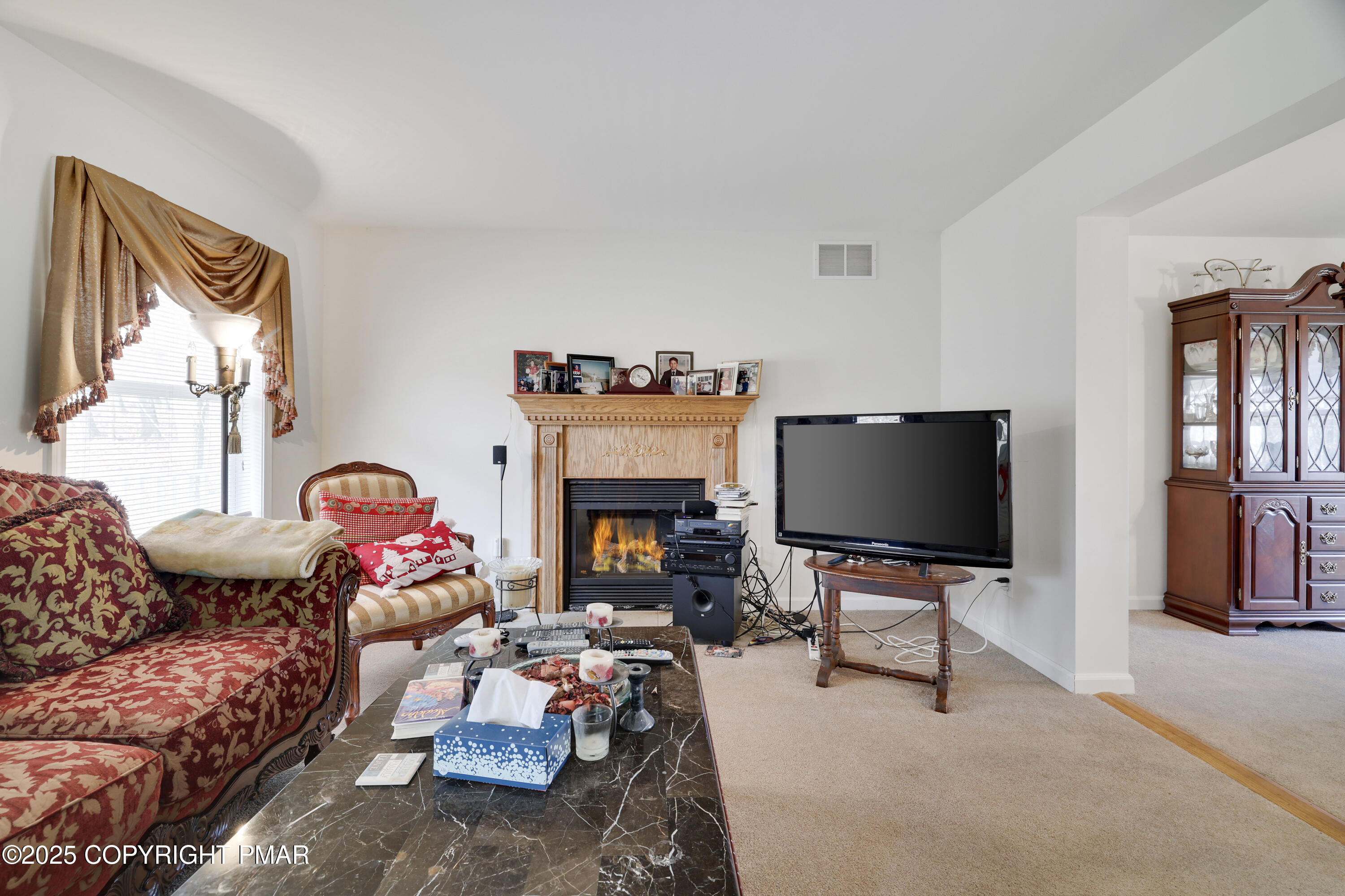 138 Jennifer Lane Effort, PA 18330 - Photo 19 of 41 a living room with furniture a fireplace and a flat screen tv