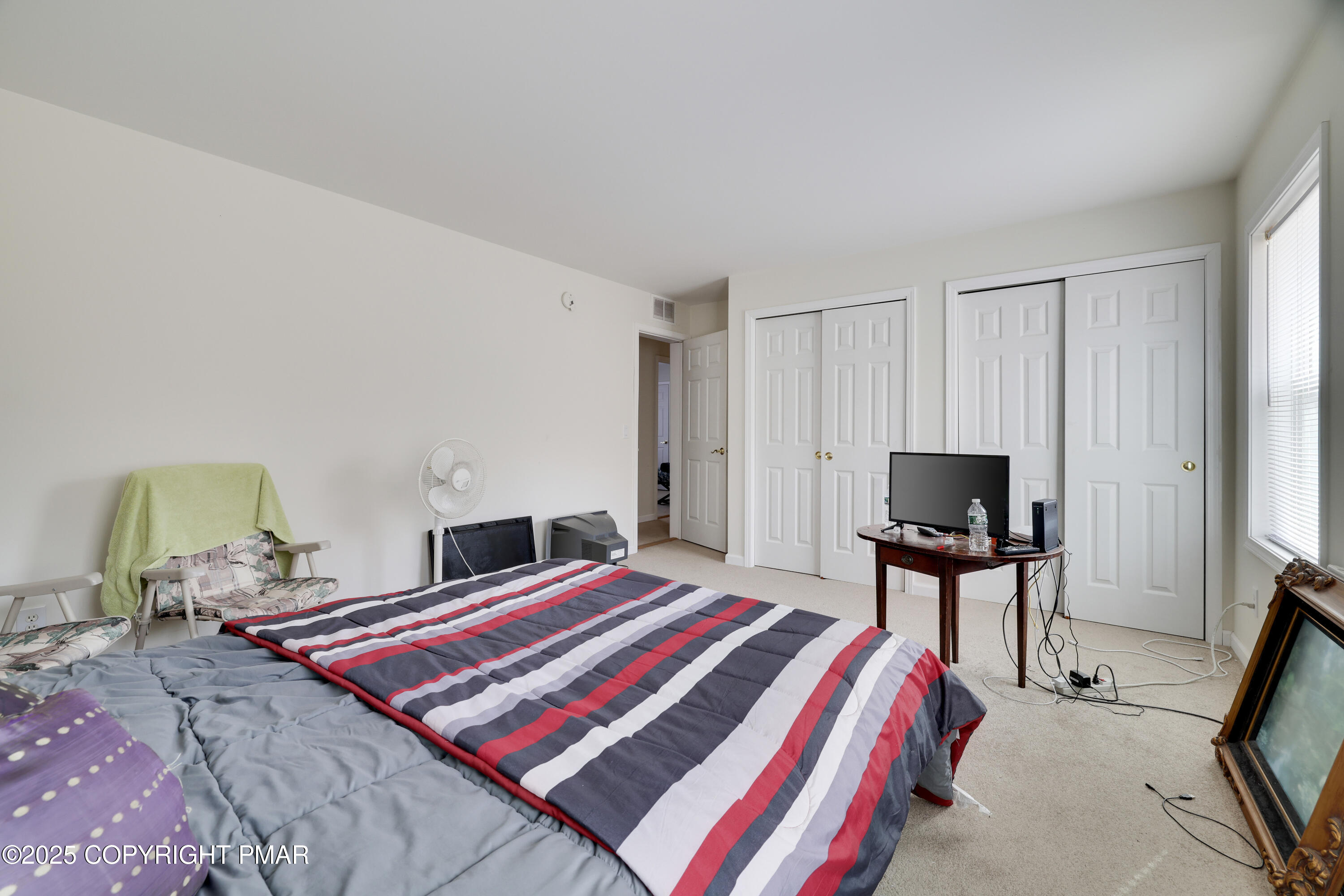 138 Jennifer Lane Effort, PA 18330 - Photo 36 of 41 a bedroom with a bed and a chair in it