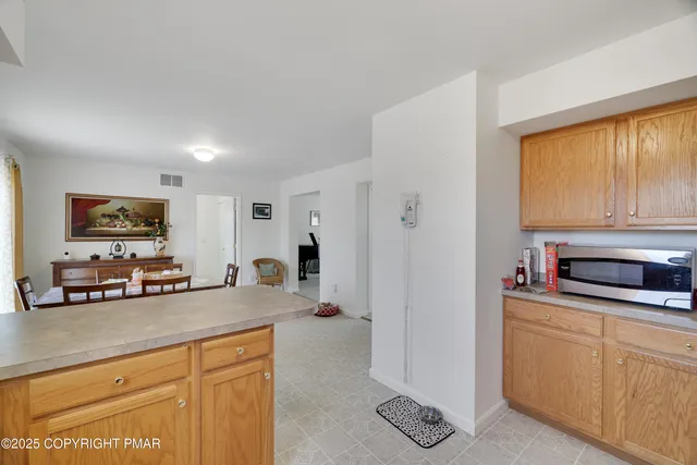 a kitchen with granite countertop a sink cabinets and window