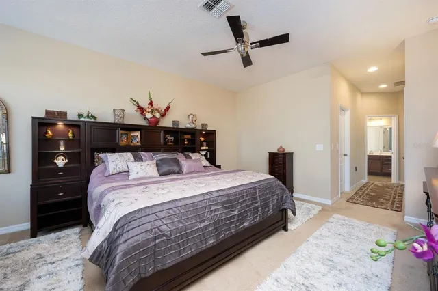 a bathroom with a double vanity sink bathtub large mirror and double