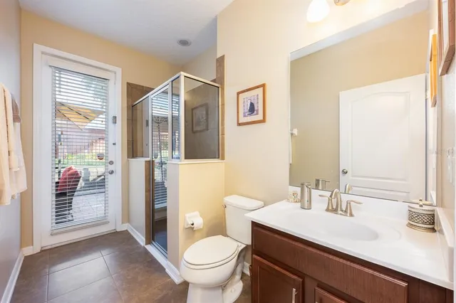 a bedroom with a bed and a lamp