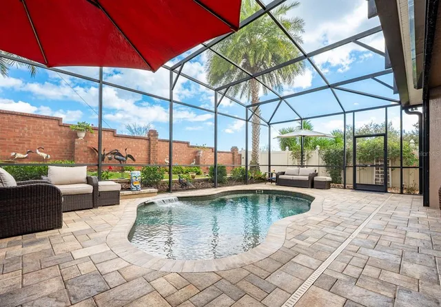 a view of a swimming pool with a lounge chair