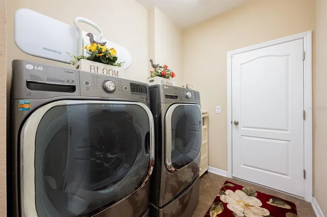a living room with furniture gym equipment and a large window