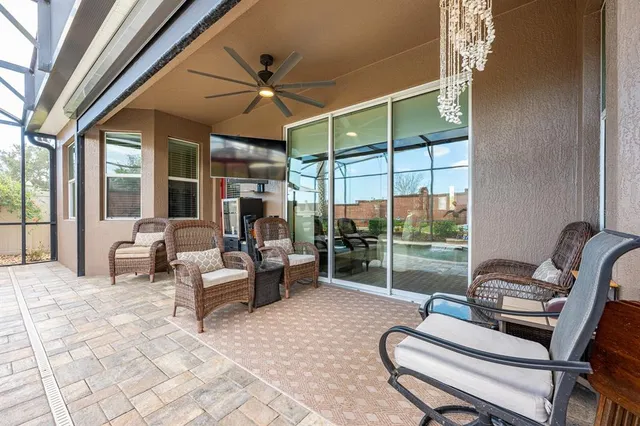 a view of swimming pool with outdoor seating