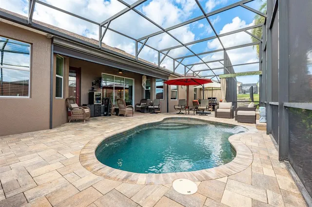 a view of living room with patio furniture and a yard