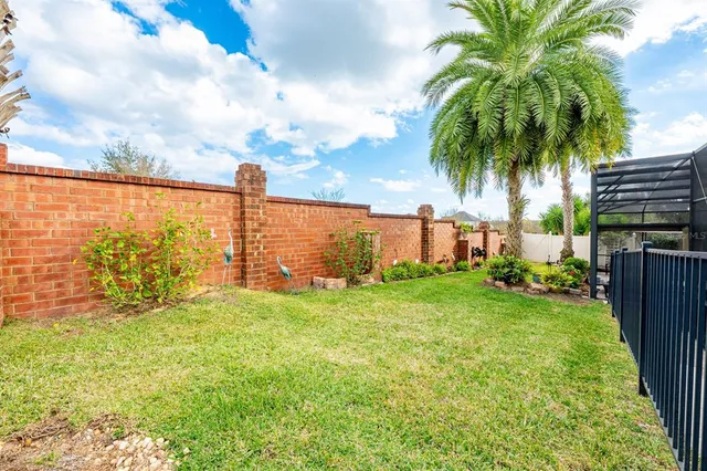 an aerial view of a residential houses with outdoor space