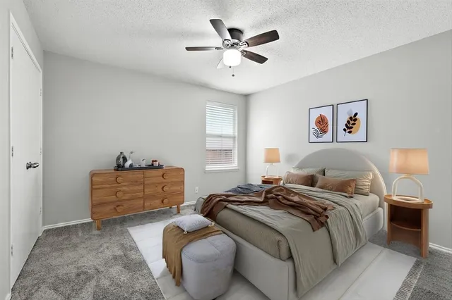 a bedroom with bed and window