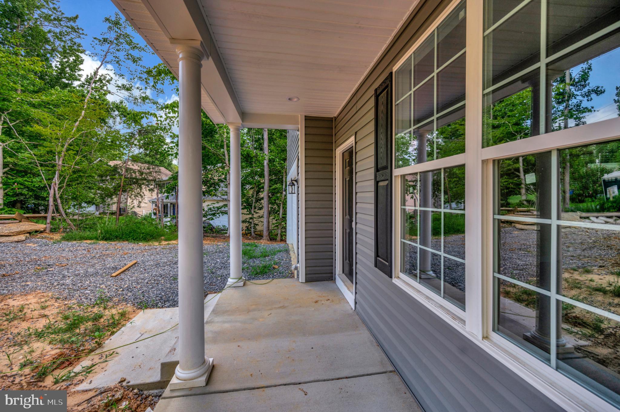 6077 Hamlin Circle King George, VA 22485 - Photo 13 of 50 a porch with a yard