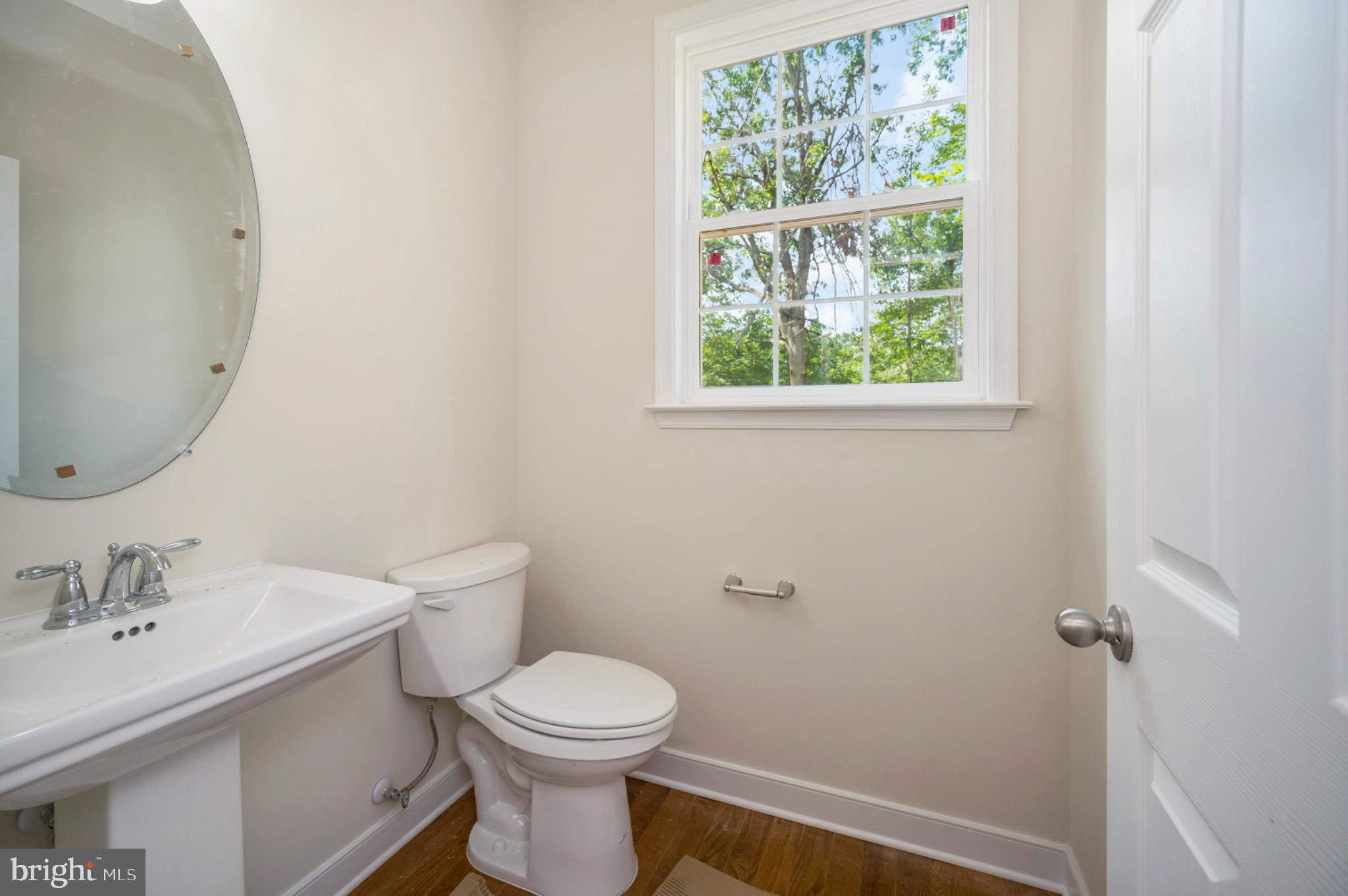 6077 Hamlin Circle King George, VA 22485 - Photo 18 of 50 a white toilet sitting next to a bathroom sink
