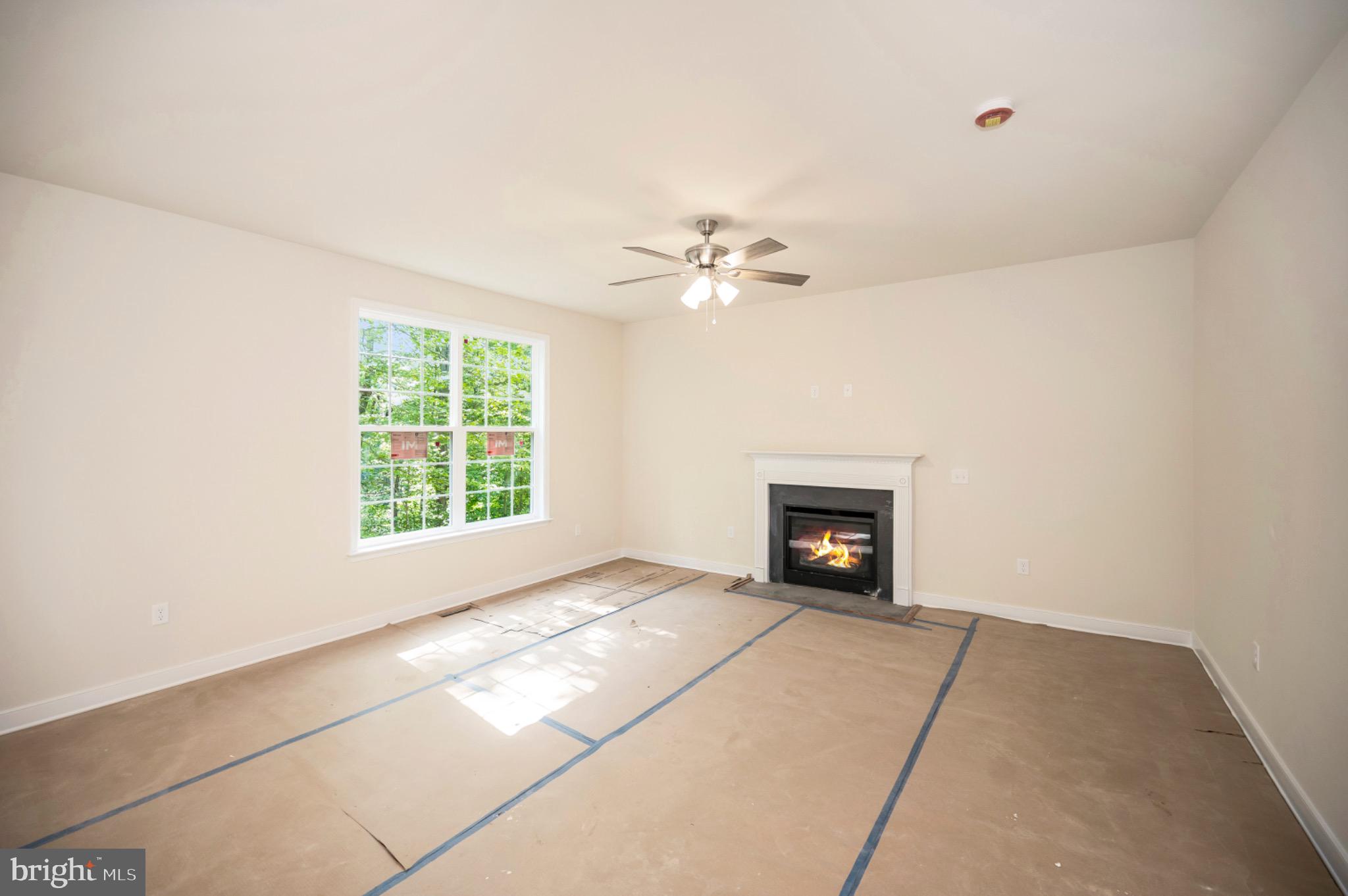 6077 Hamlin Circle King George, VA 22485 - Photo 19 of 50 an empty room with windows and fireplace
